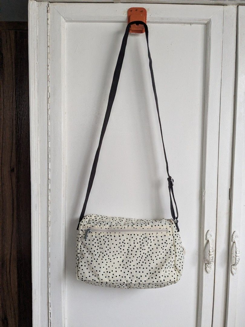 Kipling Syro Soft Dot Crossbody Bag (Category: Cross-body Bags) located in Quezon City. Submitted by nnncorner (Listing ID 1459321204, Image 3). Description: Original Kipling Syro Soft Dot Crossbody Bag Clean inside and outside No any issues Good as new! 100% Original! Strap down to bottom - 35 inches adjustable Length - 9 inches Width - 13 inches Original price 99$ / 6,000 in Philippine peso Water Resistant Snap and Zip Lock Closure This is so p