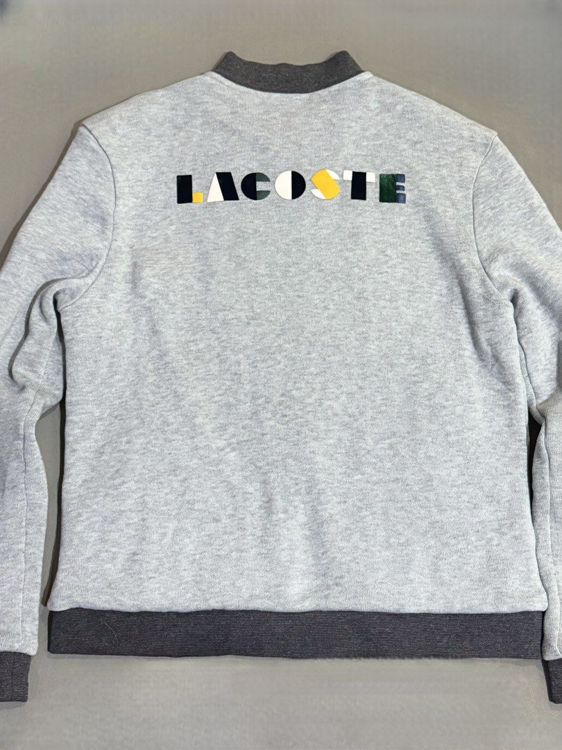 Lacoste Grey Jacket (21x26) (Category: Coats, Jackets and Outerwear) located in Manila. Submitted by luggages.co (Listing ID 1459389480, Image 2). Description: Lacoste 21x26 size.