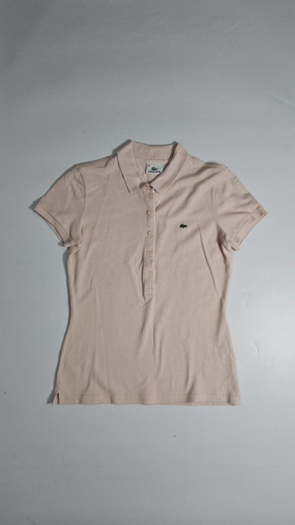 Lacoste polo shirt (Category: Others Tops) located in Alfonso. Submitted by jbcamet (Listing ID 1459334833, Image 1). Description: - Brand: Lacoste - Type: Polo Shirt - Color: Pastel Pink - Size: 38 (EU/UK 10/US 6/Medium) - Features: Embroidered Lacoste crocodile logo, buttoned placket - Material: Likely cotton blend (typical for Lacoste polos, check care tag for specifics) - Condition: Excellent, pre-loved - Style: Classic, versatile, smart casu