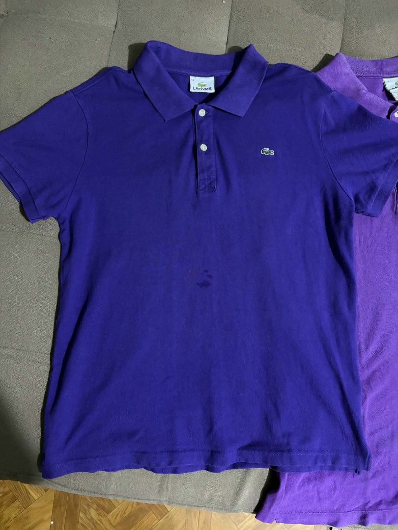 Lacoste Purple Polo Shirts (2 pcs) (Category: Tshirts & Polo Shirts ) located in Manila. Submitted by thriftthings824 (Listing ID 1459424344, Image 2). Description: - Two purple Lacoste polo shirts available. - One shirt in a darker shade of purple, the other in a lighter shade. - Both feature the signature Lacoste crocodile logo. - Designed in France, made in Peru. - Ideal for casual wear or a sporty aesthetic. - Please check the photos for deta