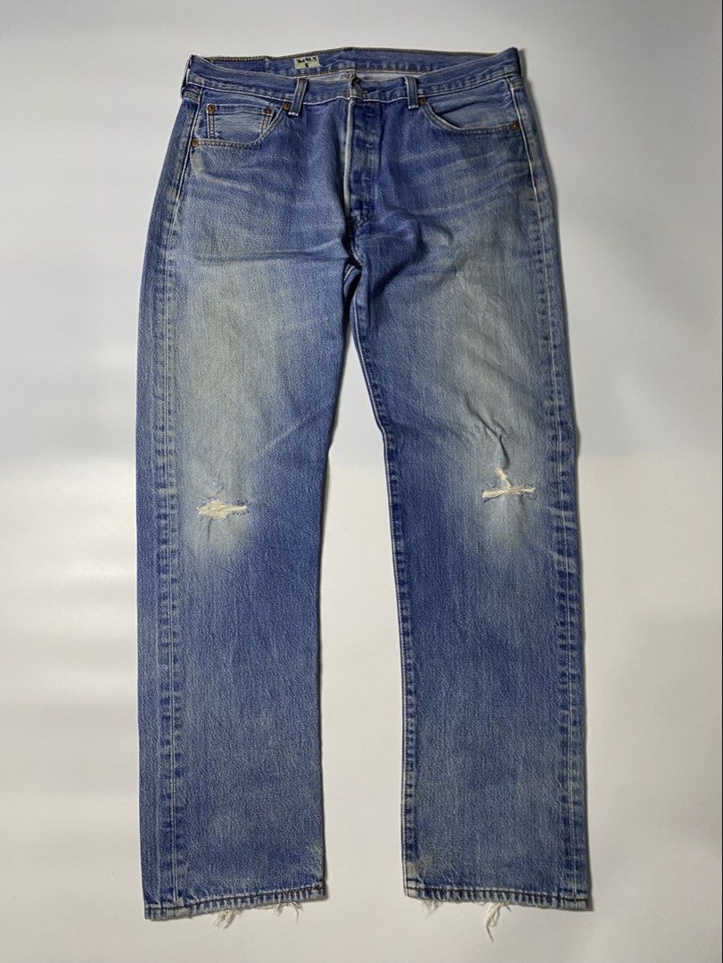 Levi's 501 Button Fly Jeans W36 L32 (Category: Jeans) located in Cabuyao City. Submitted by macnthrifts. (Listing ID 1459407550, Image 2). Description: - Classic Levi's 501 jeans - Button fly closure - Medium wash blue denim - Distressed knees and rips (as pictured) - Frayed hem - Wardrobe staple for casual wear.