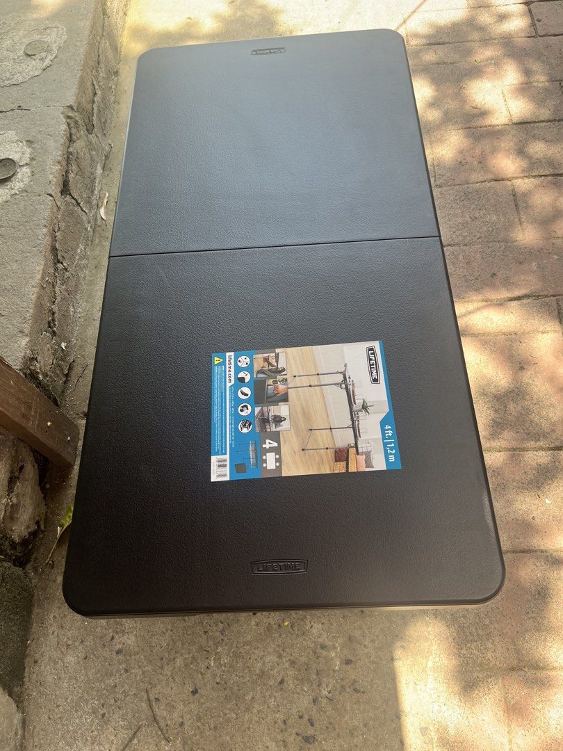 Lifetime 4ft Folding Table (Category: Tables & Sets) located in Marikina City. Submitted by loraineroy1016 (Listing ID 1459332944, Image 3). Description: - Lifetime 4ft (1.2m) folding table - Sturdy and portable design - Ideal for events, parties, or as extra workspace - Folds in half for convenient storage and transport - Built-in handle for easy carrying - Textured surface finish.