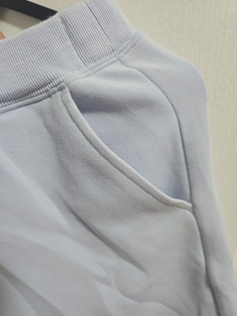 Uniqlo Light Blue Sweatpants with Pockets (Category: Other Bottoms) located in Pasig City. Submitted by callmemaf (Listing ID 1459349032, Image 3). Description: - KIDS 160 - Side pockets - Ribbed waistband and cuffs - Comfortable material - Ideal for lounging or casual wear - Shows slight pilling (signs of wear).
