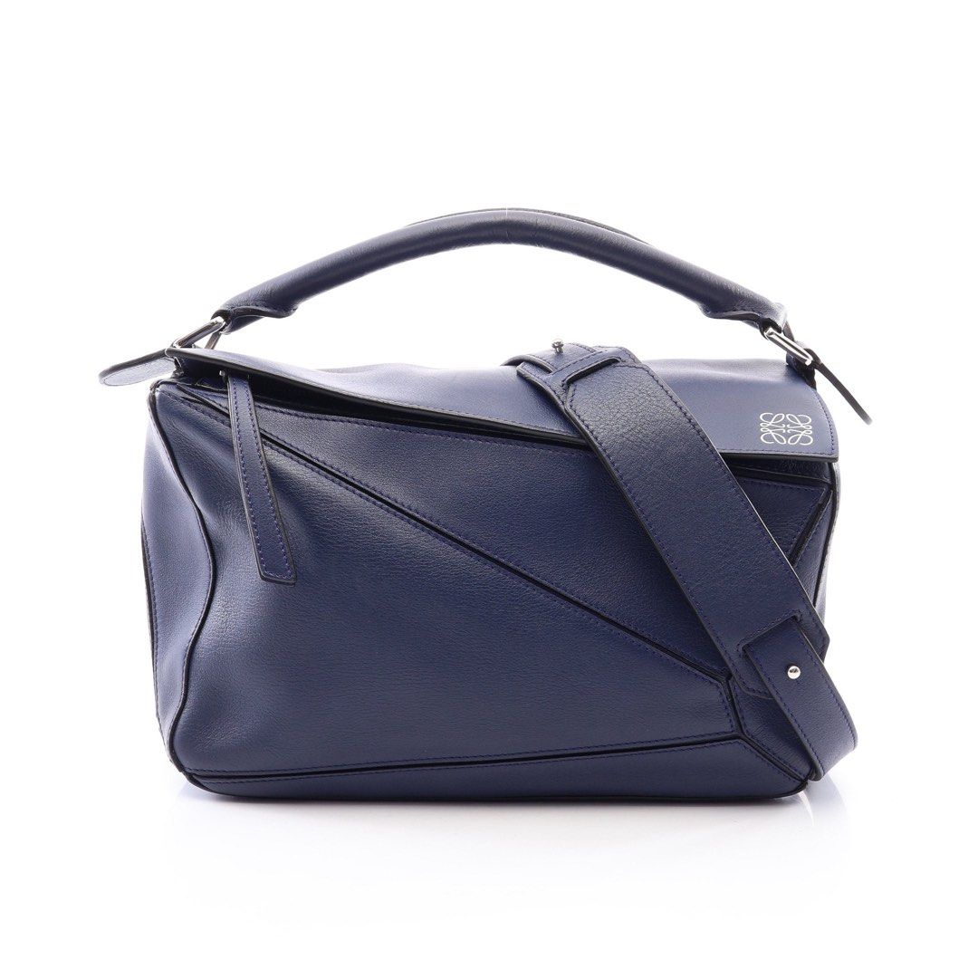Loewe Puzzle Bag Medium 2-Way Handbag Leather Navy (Category: Luxury Bags & Wallets) located in Las Pinas. Submitted by daisuki_japan_luxury_by_reiko (Listing ID 1459295418, Image 1). Description: Notable damage areas remarks Due to the nature of used items, there may be minor damage that is not visible in the images, and the color may appear different from the actual item depending on your monitor settings. If you have any questions about the co