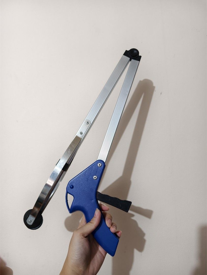 Long Reach Foldable Reacher Grabber Tool with Blue Handle (Category: Cleaning Tools & Supplies) located in General Trias. Submitted by aekyl (Listing ID 1459293803, Image 2). Description: - Long reach grabber tool - Blue handle and extendable silver arm - Rubber tips on grabber end for a secure grip - Ideal for picking up items from the floor or high shelves - Easy-to-use trigger mechanism - Folds for convenient storage RFS: decluttering.
