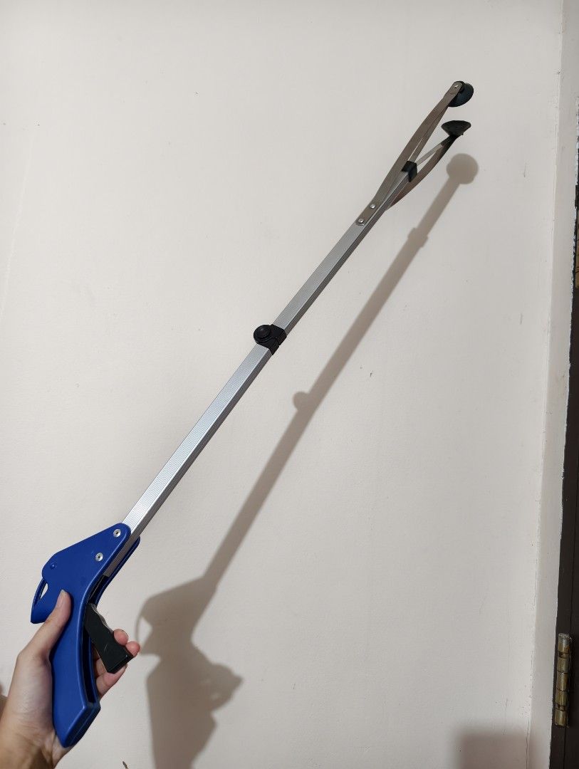 Long Reach Foldable Reacher Grabber Tool with Blue Handle (Category: Cleaning Tools & Supplies) located in General Trias. Submitted by aekyl (Listing ID 1459293803, Image 1). Description: - Long reach grabber tool - Blue handle and extendable silver arm - Rubber tips on grabber end for a secure grip - Ideal for picking up items from the floor or high shelves - Easy-to-use trigger mechanism - Folds for convenient storage RFS: decluttering.
