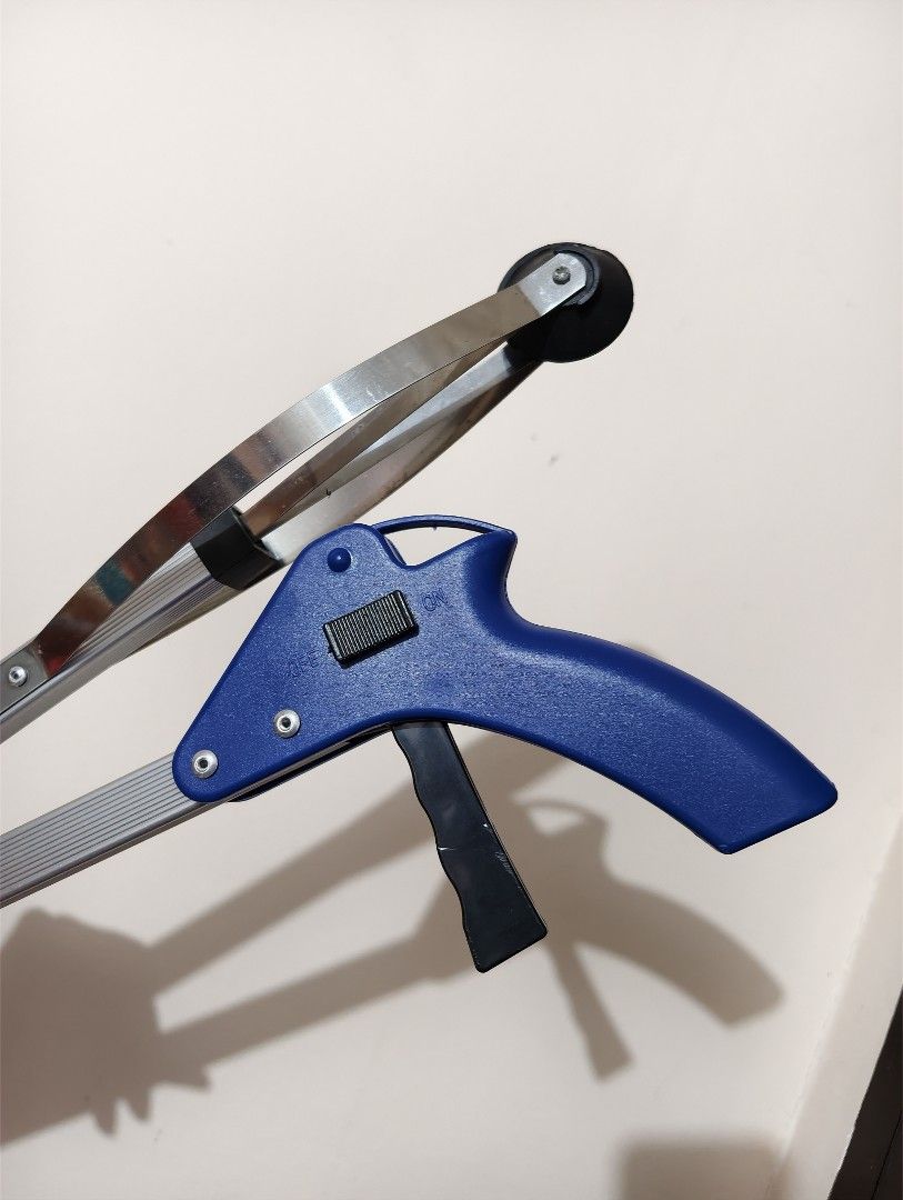 Long Reach Foldable Reacher Grabber Tool with Blue Handle (Category: Cleaning Tools & Supplies) located in General Trias. Submitted by aekyl (Listing ID 1459293803, Image 3). Description: - Long reach grabber tool - Blue handle and extendable silver arm - Rubber tips on grabber end for a secure grip - Ideal for picking up items from the floor or high shelves - Easy-to-use trigger mechanism - Folds for convenient storage RFS: decluttering.
