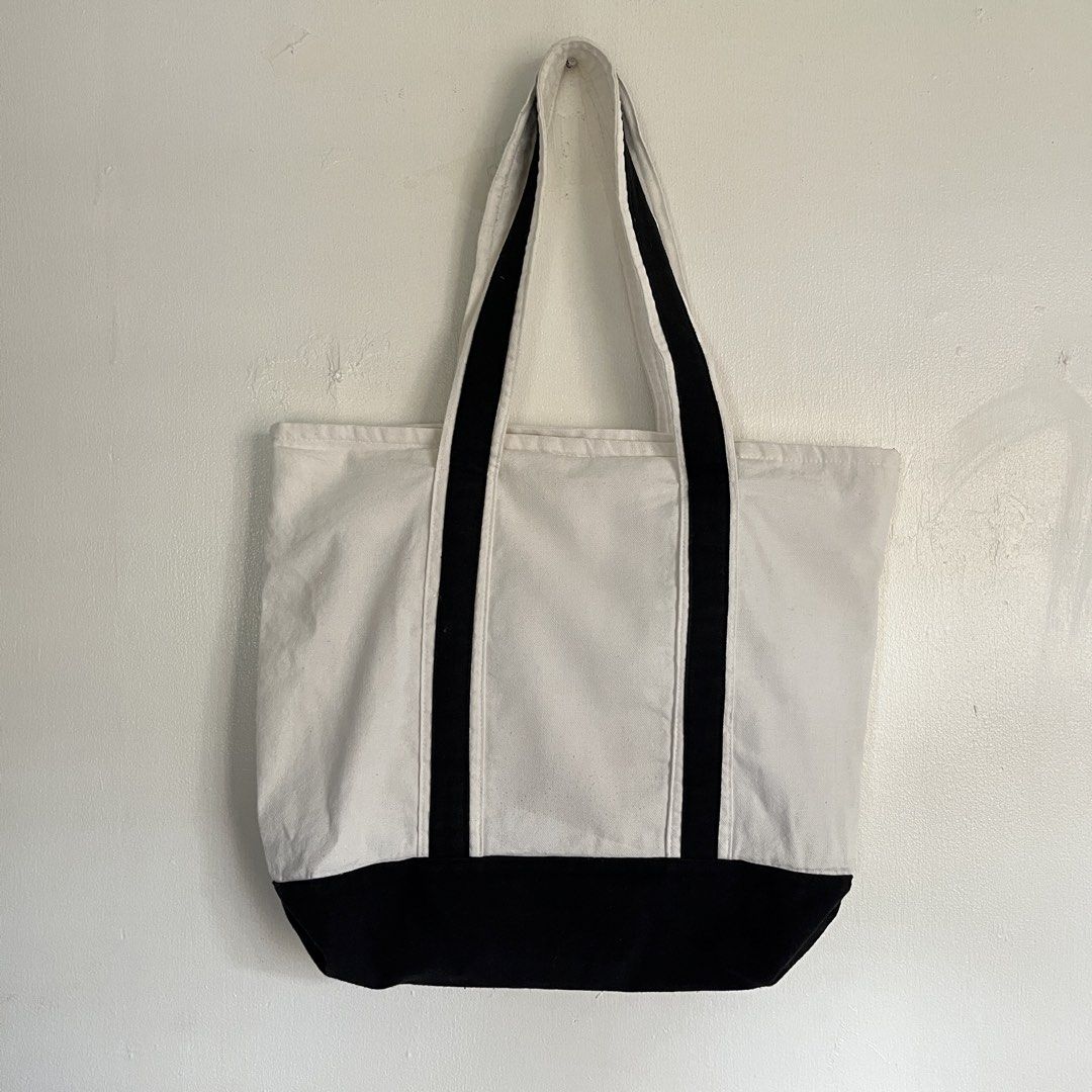 Lori Studio Canvas Tote Bag - White and Black (Category: Tote Bags) located in Las Pinas. Submitted by solfits (Listing ID 1459327142, Image 2). Description: - Classic white canvas tote bag - Black trim and handles - Convenient front pocket - Handy interior pocket - Simple and versatile design - Ideal for everyday use and carrying essentials.