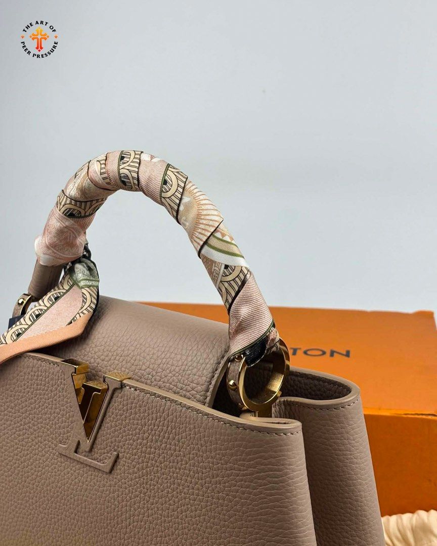 Louis Vuitton Capucines MM (Category: Luxury Bags & Wallets) located in Calamba. Submitted by theartofpeerpressurelgn (Listing ID 1459392800, Image 2). Description: LV Capucines MM Microchipped, with certificate of authenticity. Brand new, complete with free LV scarf worth 30K. Retails for 480K in stores. Selling for only 310K. Message for inquiries. FB: The Art of Peer Pressure IG: @theartofpeerpressurelgn.