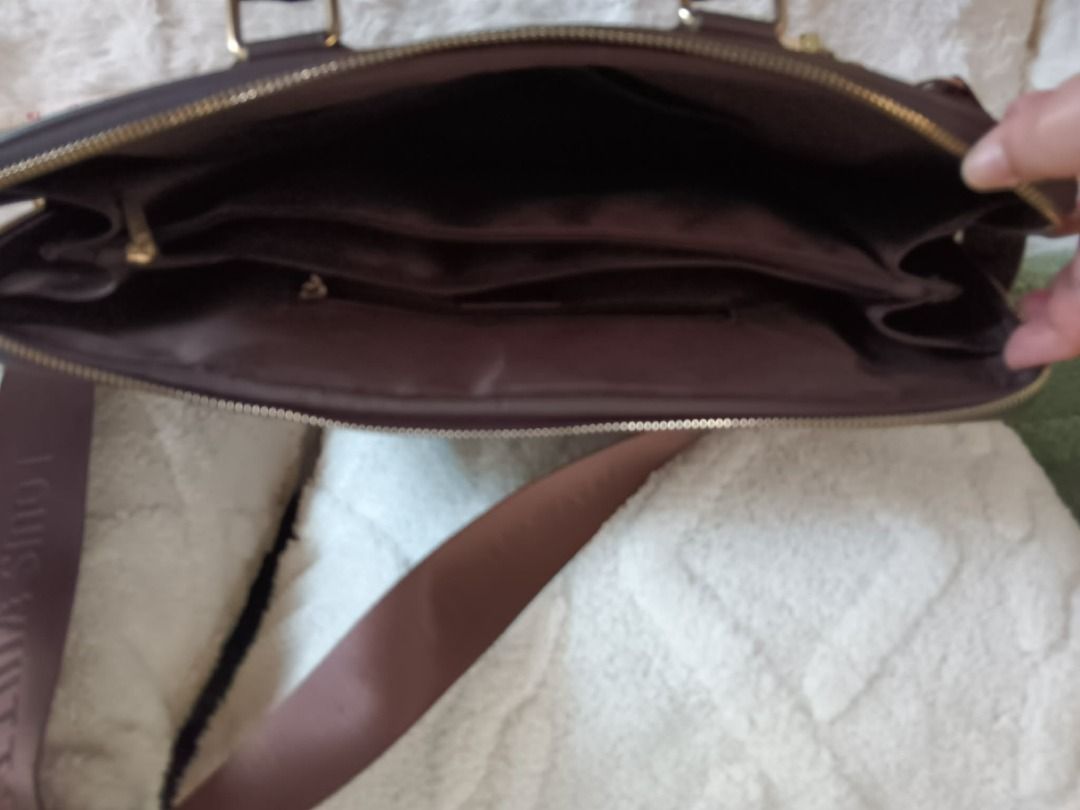 LV Monogram Laptop Bag Briefcase (Category: Luxury Bags & Wallets) located in Santa Rosa. Submitted by chelsea_shoppe (Listing ID 1459342491, Image 3). Description: - LV monogram laptop bag (Pre-loved) - Color: Brown - Main zippered compartment with internal pockets - Top handles for easy carrying - Detachable shoulder strap for versatility - Elegant gold-tone hardware - Measurements provided in photos.