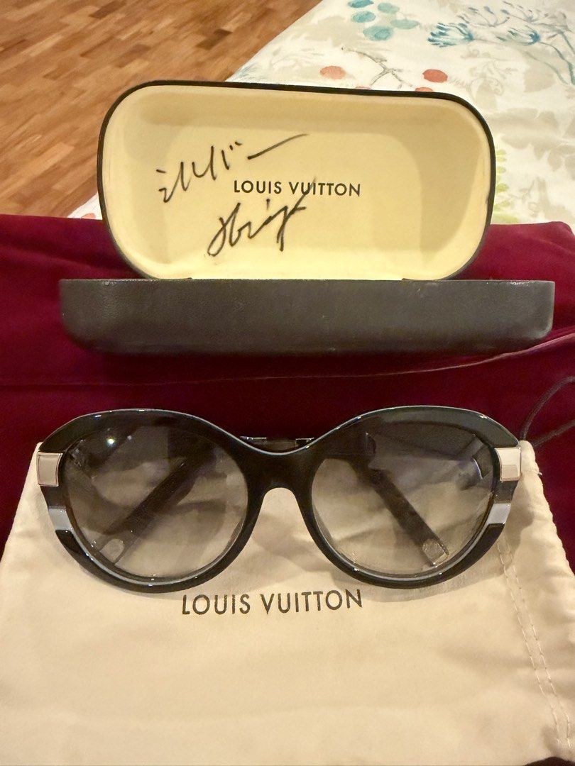 Louis Vuitton Sunglasses with Case and Pouch (Category: Sunglasses & Eyewear) located in Paranaque City. Submitted by k_martin (Listing ID 1459343686, Image 1). Description: - Authentic Louis Vuitton sunglasses - Black frame with subtle glitter details -Silver hardware - Comes with original hard case and soft pouch - Note: Original case has some writing inside .