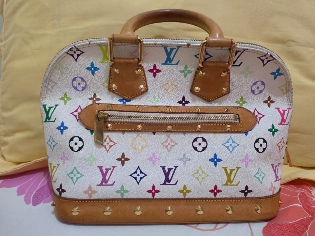 Louis Vuitton White Multicolore Alma PM Bag (Category: Luxury Bags & Wallets) located in Cavite. Submitted by kazi_preloved (Listing ID 1459356732, Image 2). Description: - 100% Authentic Louis Vuitton x Takashi Murakami Monogram Multicolore Alma PM handbag - white leather is clean, no discoloration - Leather trim and handles with signs of wear, black dots, watermarks, and patina - Smooth working zipper - Gold-toned hardware, still shiny, no tarn