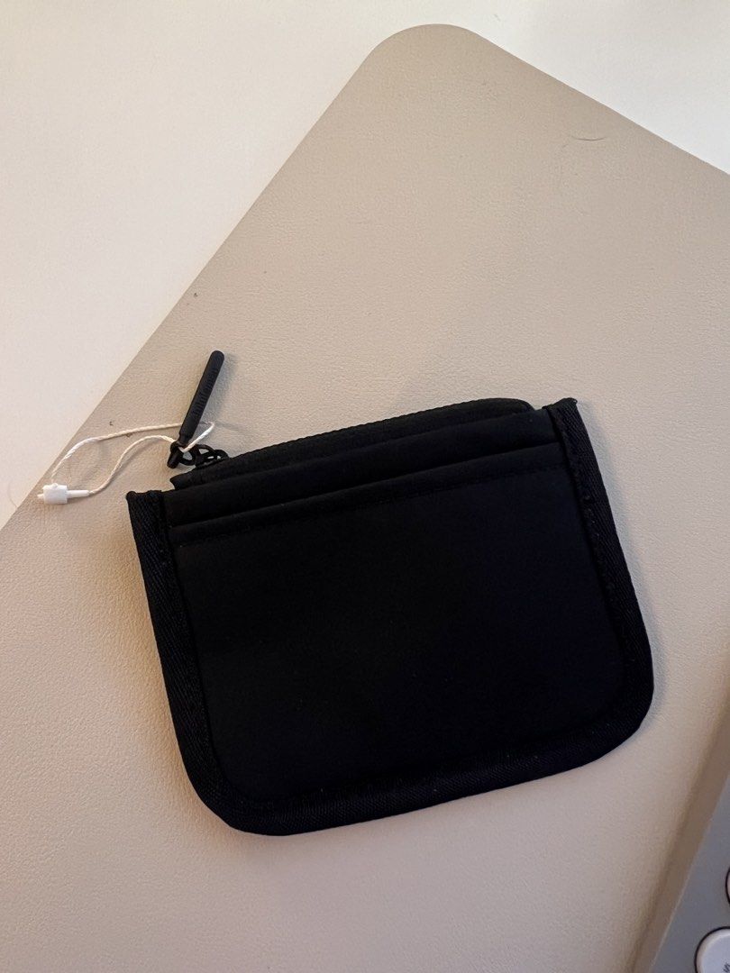 Lululemon Black Card Holder Pouch (Category: Wallets & Card holders) located in Las Pinas. Submitted by csco.mnl (Listing ID 1459419367, Image 2). Description: - Black Lululemon card holder - Features a zippered compartment - Includes multiple card slots - Comes with a small string tag attached - Ideal for organizing cards and small essentials - Compact and easy to carry.