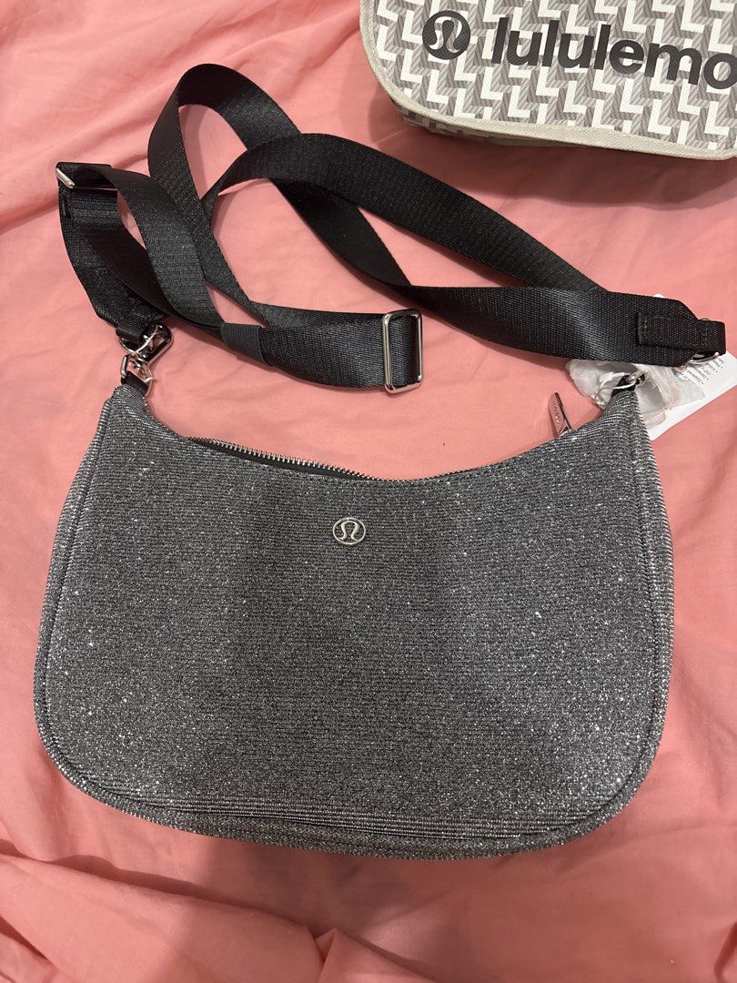 Lululemon Glitter Crossbody Bag - Silver (Category: Cross-body Bags) located in Quezon City. Submitted by eyjheyshop (Listing ID 1459382940, Image 2). Description: - Sparkly silver Lululemon crossbody bag - Main zippered compartment - Inner pocket - Adjustable strap - Comes with Lululemon dust bag - Ideal for everyday use or a night out.