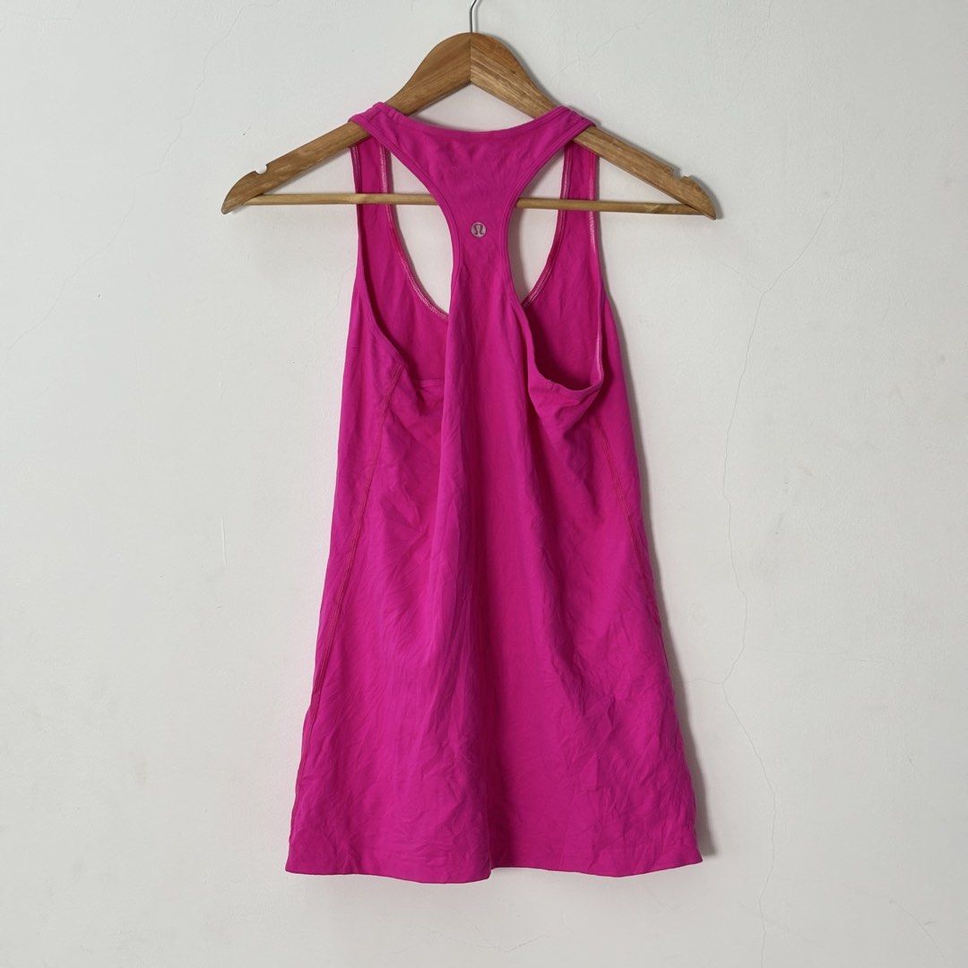 Lululemon Hot Pink Racerback Tank Top (Category: Sleeveless) located in Malilipot. Submitted by brevsthrift (Listing ID 1459336881, Image 2). Description: - Hot pink Lululemon tank top - Racerback style - Ideal for workouts or casual wear - Made with soft and breathable fabric - Versatile for layering or wearing alone - like new -W15 L26 Plus sf.