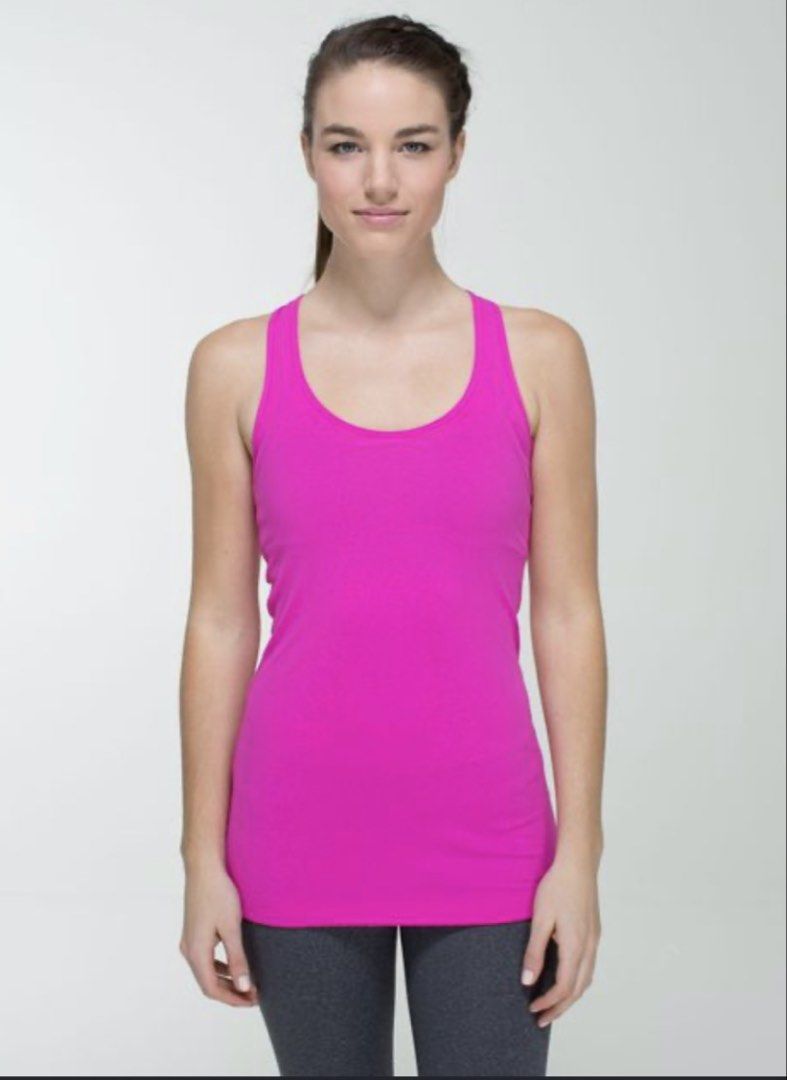 Lululemon Hot Pink Racerback Tank Top (Category: Sleeveless) located in Malilipot. Submitted by brevsthrift (Listing ID 1459336881, Image 3). Description: - Hot pink Lululemon tank top - Racerback style - Ideal for workouts or casual wear - Made with soft and breathable fabric - Versatile for layering or wearing alone - like new -W15 L26 Plus sf.