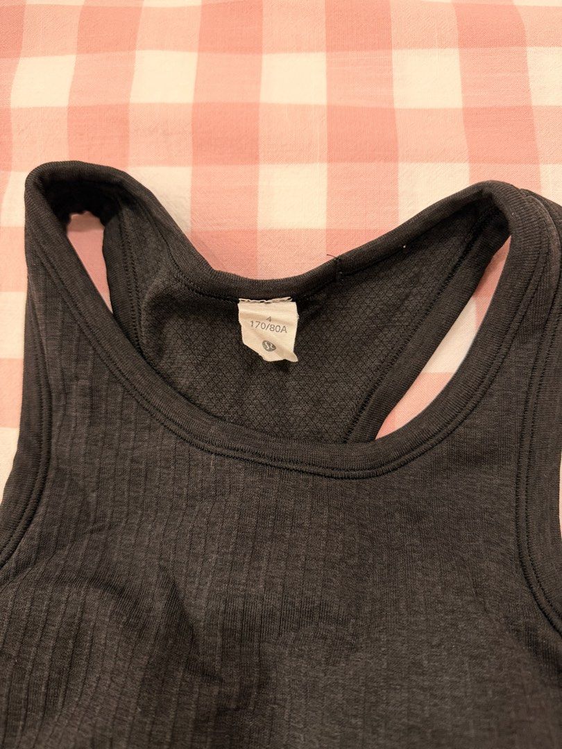 LULULEMON RIBBED RACER BACK TANK TOP (Category: Activewear) located in Abulug. Submitted by joysmithznjo (Listing ID 1459338098, Image 3). Description: - Black ribbed racerback tank top - Soft and stretchy material - Ideal for workouts or casual wear - Features Lululemon logo at the back - Size: L (170/80A).
