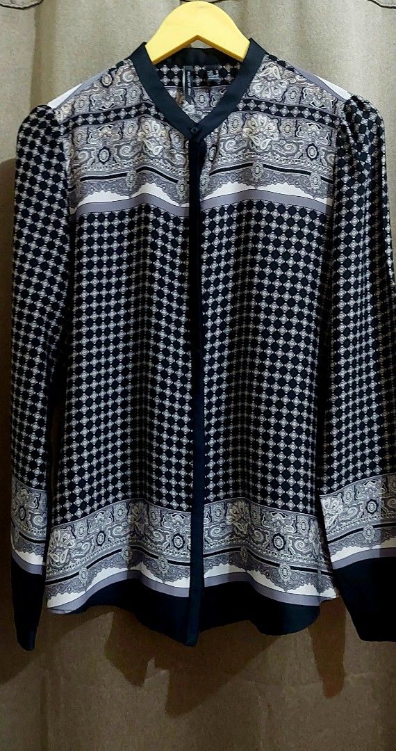 Mango Collection Black & White Printed Button-Up Blouse Size M (Category: Blouses) located in Makati City. Submitted by heinzly (Listing ID 1459297673, Image 2). Description: - Mango Collection blouse - Size: M - Color/Print: Black and white geometric and paisley print - Style: Button-up front with mandarin collar - Sleeves: Long sleeves with button cuffs - Origin: Made in Morocco - Condition: Only worn once.