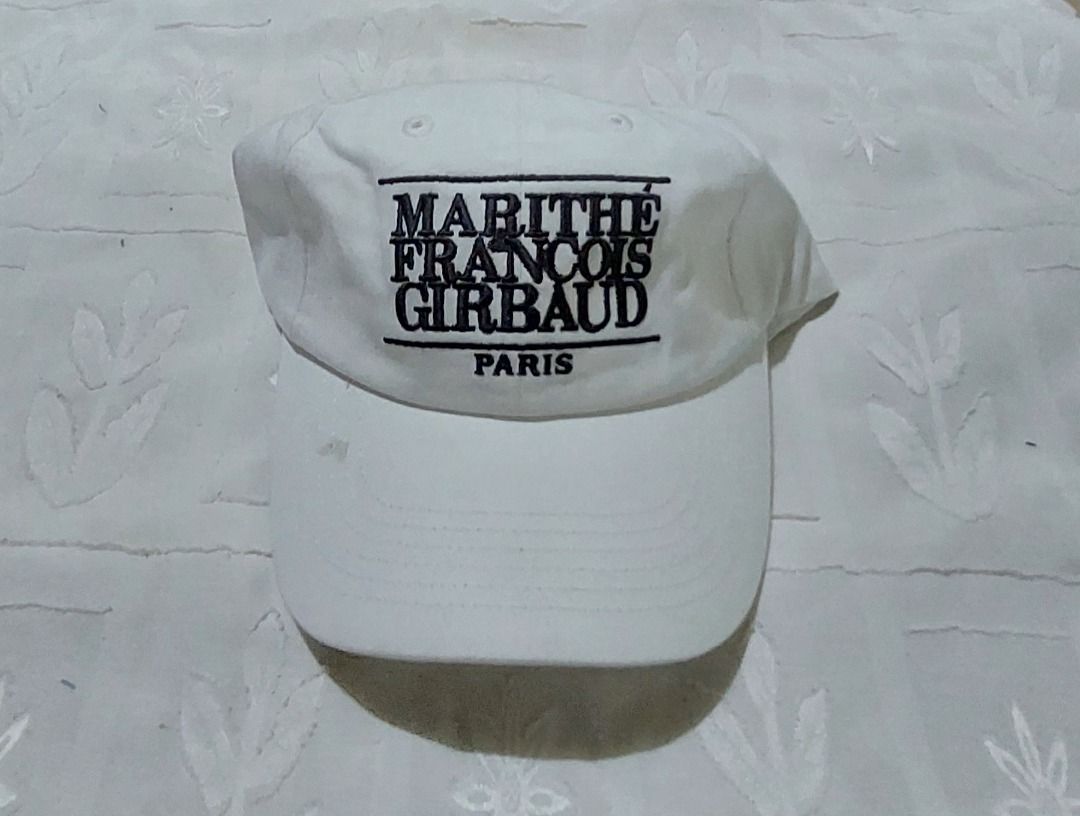 MARITHE FRANCOIS GIRBAUD PARIS White Baseball Cap (Category: Caps & Hats) located in Legazpi City. Submitted by street_uniform (Listing ID 1459336492, Image 1). Description: - White Marithe Francois Girbaud baseball cap - Features embroidered brand name on the front - Classic design with an adjustable strap at the back - Perfect for everyday wear.