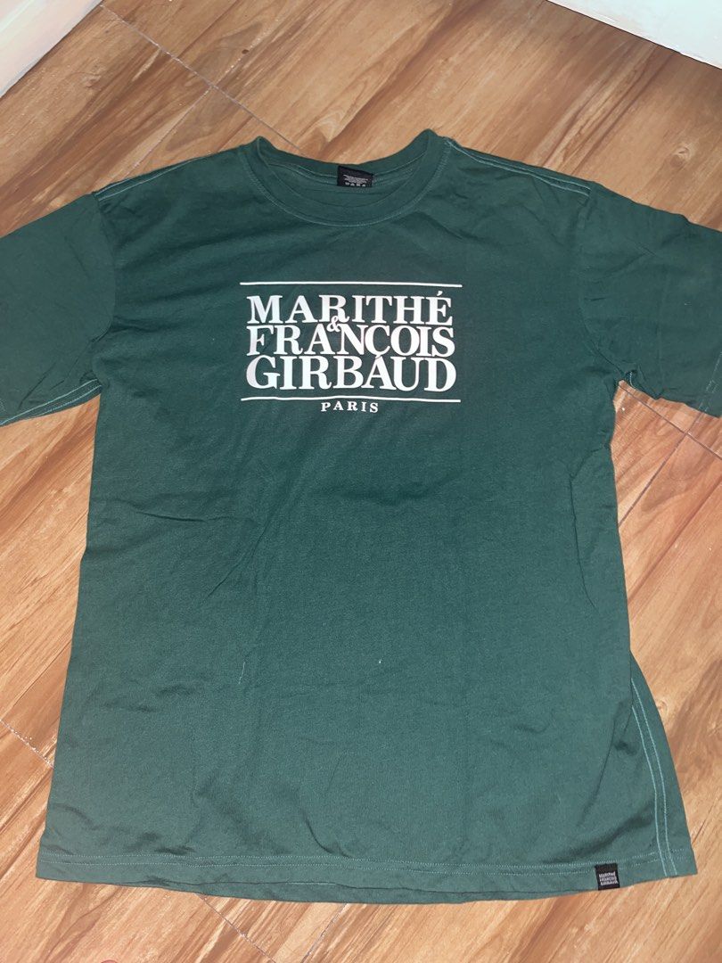 MARITHE FRANCOIS GIRBAUD Paris Green T-Shirt (Category: Shirts) located in Manila. Submitted by gbrxql (Listing ID 1459453287, Image 1). Description: - Brand: Marithe Francois Girbaud - Color: Green - Design: Features brand name and 'Paris' print on the front - Style: Simple, classic tee - Occasion: Ideal for casual wear.