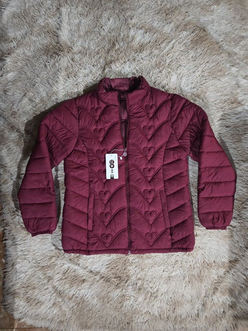 Maroon Puffer Jacket with Heart Pattern (Category: Coats, Jackets and Outerwear) located in Paranaque City. Submitted by ccc_finds (Listing ID 1459445371, Image 1). Description: Size: XL Measurements: Shoulder - 16 in. Chest width - 20 in. Jacket length - 26 in. Sleeve length - 24 in. Arms sleeve width - 7.5 in. .