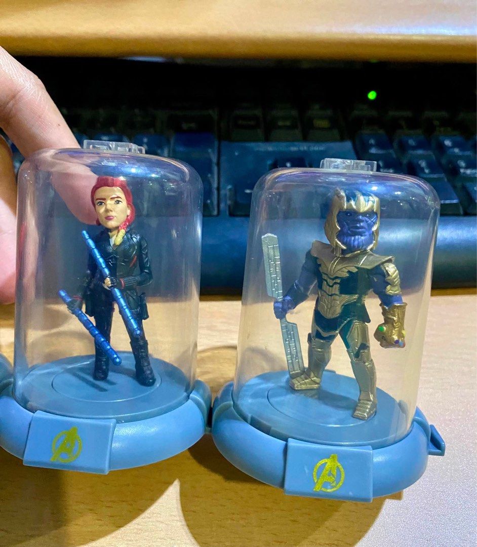 Marvel Avengers Mini Figures in Display Cases (Category: Figurines & Statues) located in Cagayan de Oro. Submitted by sethmarko27 (Listing ID 1459433643, Image 2). Description: - Set of 4 Marvel Avengers mini figures - Includes Thor, Thanos, Black Widow, and Nebula - Each figure in its own clear display case - Features an Avengers logo base for each figure - Perfect for any Marvel fan's collection - Display cases are clean.