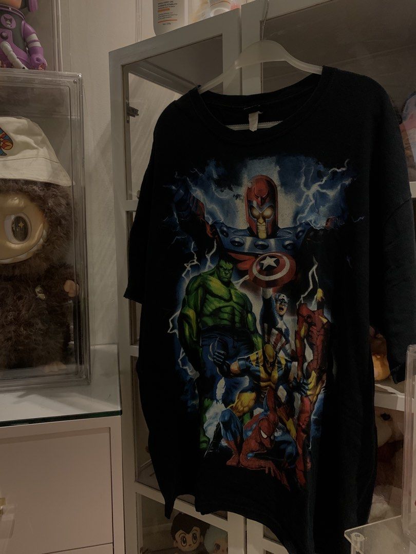 Marvel Avengers T-Shirt Mad Engine (Category: Tshirts & Polo Shirts ) located in Manila. Submitted by vintaurafindsco. (Listing ID 1459339493, Image 1). Description: - Black Marvel Avengers t-shirt by Mad Engine - Features Captain America, Iron Man, Hulk, Spider-Man, Wolverine, and Magneto - Great for any Marvel fan.
