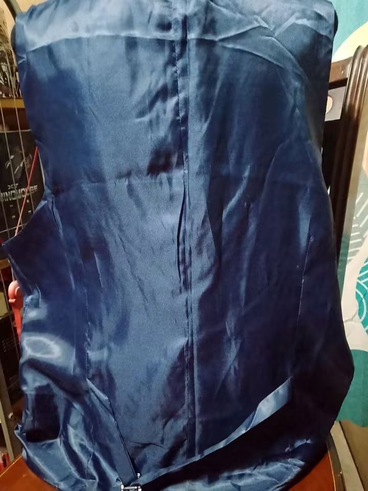 Men's Blue Formal Vest (Category: Vests) located in Batangas. Submitted by sheenx.09 (Listing ID 1459421100, Image 2). Description: - 2xl on tag (XL to 2xl) - Classic blue formal vest 🫶 - Button-up front with three buttons - Left chest pocket 😉 - Smooth satin lining ✅ - Ideal for formal occasions or as part of a suit.