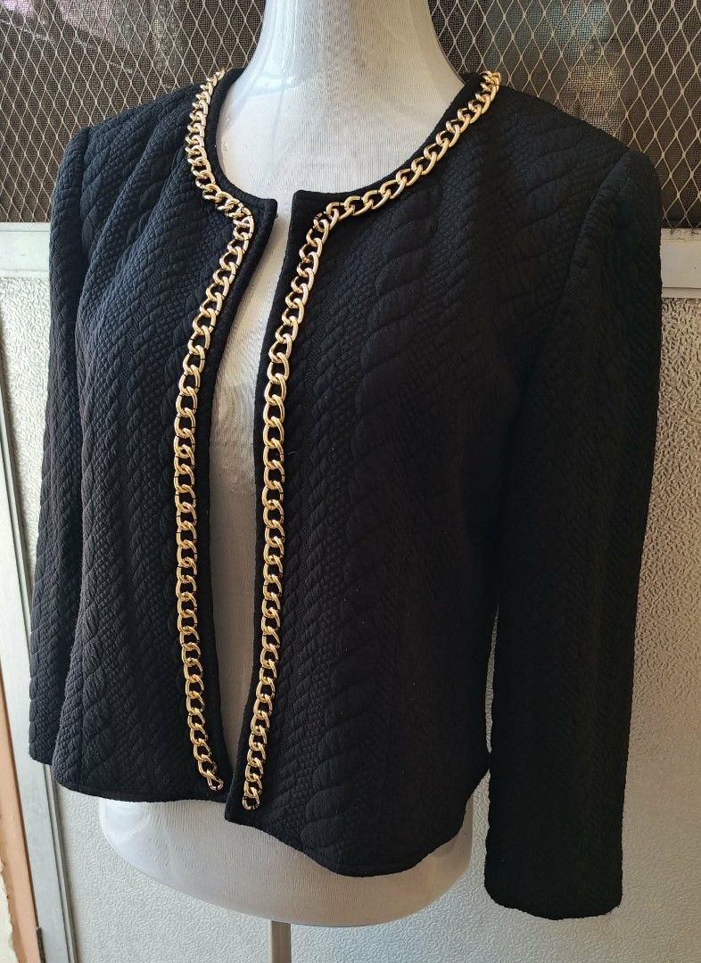 Michelle Black Quilted Chain Trim Jacket (Category: Coats, Jackets and Outerwear) located in Cebu City. Submitted by violacloset (Listing ID 1459359689, Image 2). Description: - Black quilted jacket from Michelle - Elegant gold chain trim along neckline and opening - Flattering cropped length - Stylish 3/4 sleeves Measurements: length: 20 in width: 18 in arm length: 20 1/2 in.