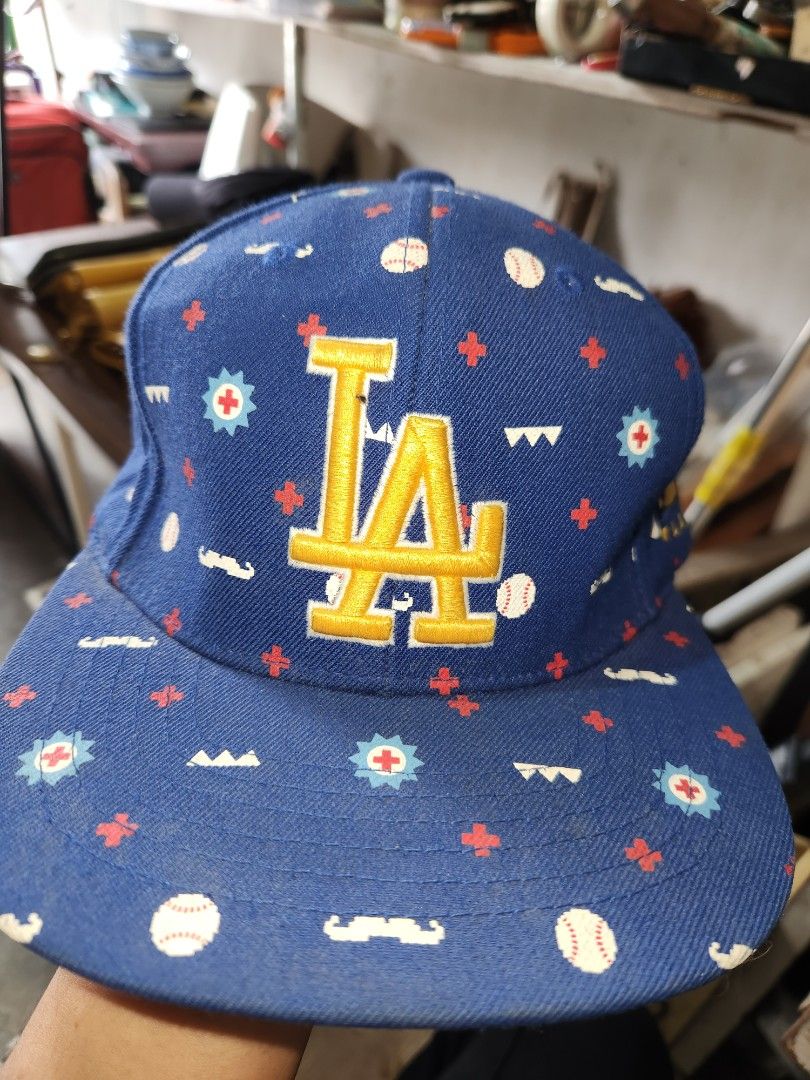 MLB Los Angeles Dodgers Baseball Cap (Category: Caps & Hats) located in Quezon City. Submitted by amber___18 (Listing ID 1459358246, Image 1). Description: - Blue MLB cap with all-over print - Features LA Dodgers logo on the front - MLB logo on the side - Made in Korea - Adjustable strap at the back - Ideal for any baseball fan.