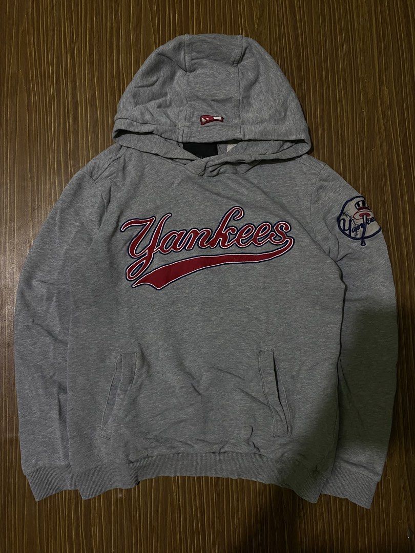 MLB New York Yankees pullover hoodie with an embroidered team script (Category: Coats, Jackets and Outerwear) located in Bansalan. Submitted by cjs_thrift (Listing ID 1459424069, Image 1). Description: - SMALL - DIMENSIONS: 20 by 25 - COLOR RATE:9.5/10 - VERY GOOD CONDITION - NO ISSUE - COMPLETE TAGS - WASHED.