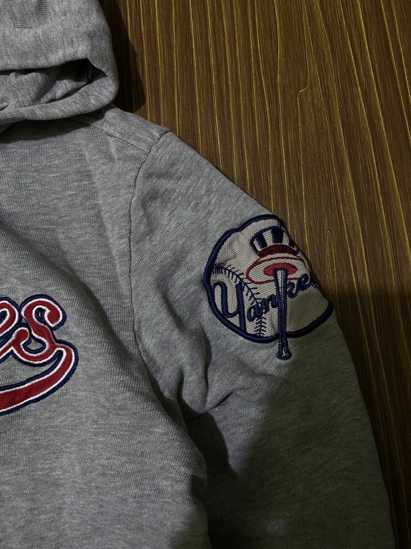 MLB New York Yankees pullover hoodie with an embroidered team script (Category: Coats, Jackets and Outerwear) located in Bansalan. Submitted by cjs_thrift (Listing ID 1459424069, Image 3). Description: - SMALL - DIMENSIONS: 20 by 25 - COLOR RATE:9.5/10 - VERY GOOD CONDITION - NO ISSUE - COMPLETE TAGS - WASHED.