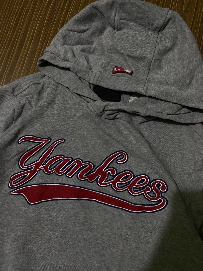MLB New York Yankees pullover hoodie with an embroidered team script (Category: Coats, Jackets and Outerwear) located in Bansalan. Submitted by cjs_thrift (Listing ID 1459424069, Image 2). Description: - SMALL - DIMENSIONS: 20 by 25 - COLOR RATE:9.5/10 - VERY GOOD CONDITION - NO ISSUE - COMPLETE TAGS - WASHED.