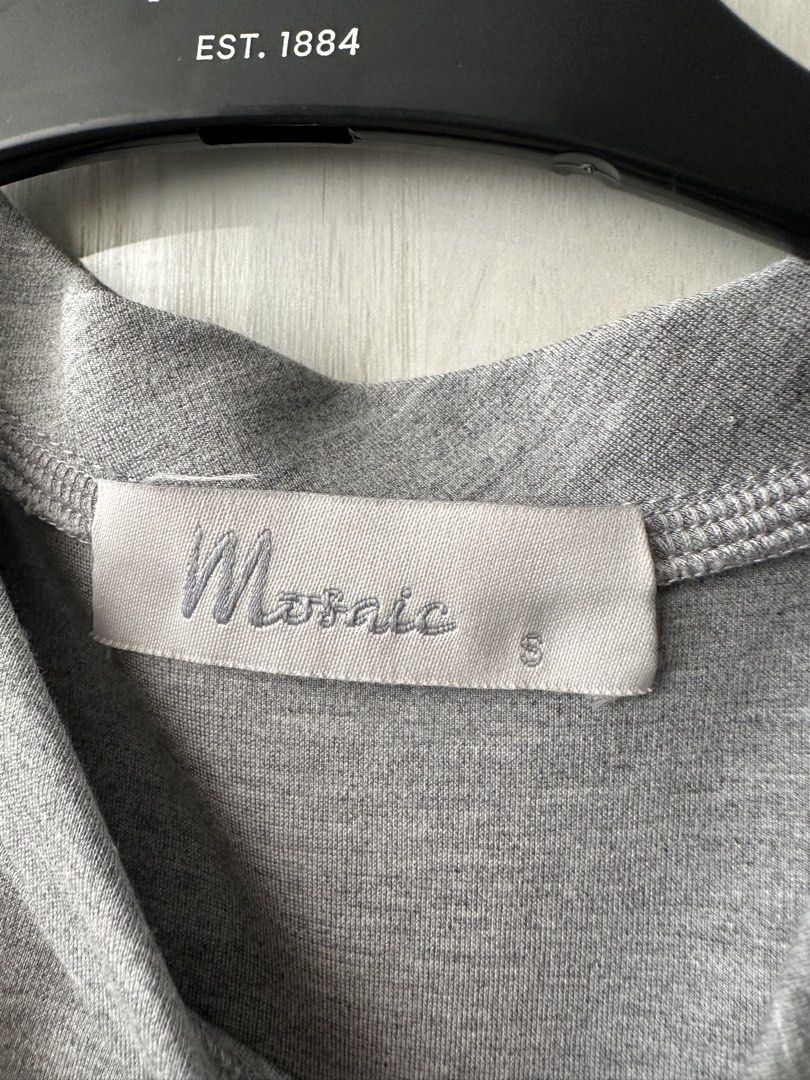 Mosaic Grey Sleeveless Top with Button Details Size S (Category: Sleeveless) located in Quezon City. Submitted by bqchane (Listing ID 1459322968, Image 2). Description: - Brand: Mosaic - Color: Grey - Style: Sleeveless top - Features: Button details on the sides - Material: Comfortable fabric - Size: S - Occasion: Casual wear.