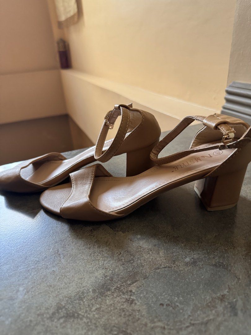 N STYLE Tan Block Heel Sandals with Ankle Strap (Category: Heels) located in Bacoor. Submitted by nicafindssince2022 (Listing ID 1459405417, Image 3). Description: - Brand: N STYLE - Color: Tan - Style: Block heel sandals - Features: Ankle strap with buckle closure, open toe - Heel Height: Moderate, comfortable for extended wear - Condition: Soles show some signs of wear - Versatility: Great for dressing up or down - Size 40.
