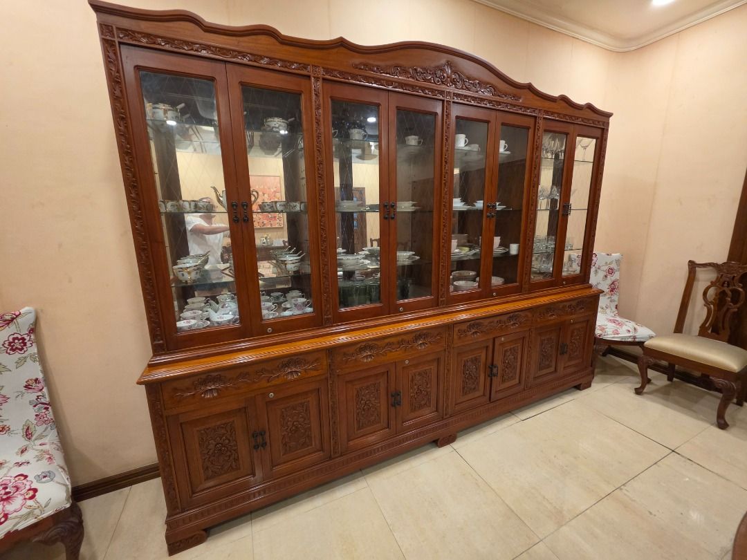 Large Narra Wood China Cabinet (Category: Shelves, Cabinets & Racks) located in Mandaluyong City. Submitted by ro_yo (Listing ID 1459399742, Image 2). Description: - Large narra wood China Cabinet - 8 narra wooden-framed glass doors (with key locks) on top for display and mirrors as backing for each - Ample storage space below with cabinets and drawers (with key locks) - Beautiful and intricate carvings - Ideal for large dining rooms or living ar