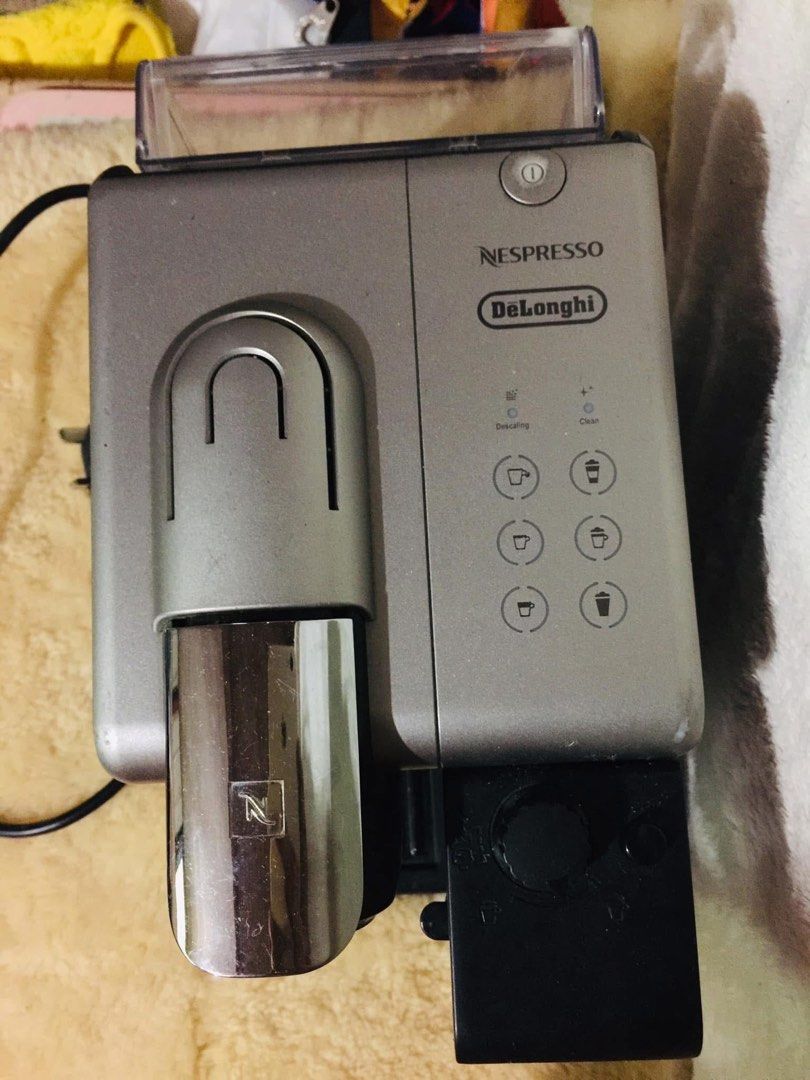 Nespresso DeLonghi Coffee Machine (Category: Coffee Machines & Makers) located in Baguio. Submitted by izza_thrifty (Listing ID 1459361805, Image 3). Description: - Nespresso coffee machine by DeLonghi - Works well and makes great coffee - Easy to operate - Includes power cord - Ready for a new home.