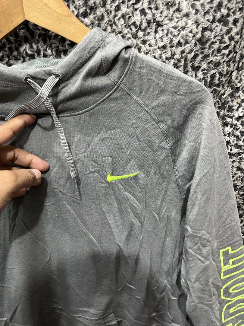 Nike Dri-FIT "Just Do It" Pullover Hoodie | Size XL (Category: Hoodies) located in General Trias. Submitted by zrchustle.604 (Listing ID 1459480825, Image 3). Description: Nike Dri-FIT "Just Do It" Pullover Hoodie in heather charcoal gray featuring vibrant volt / neon green accents. Key Features Design Accents: High-visibility neon green embroidered Nike Swoosh on the left chest, matching trim running along the asymmetrical hemline, and a promine
