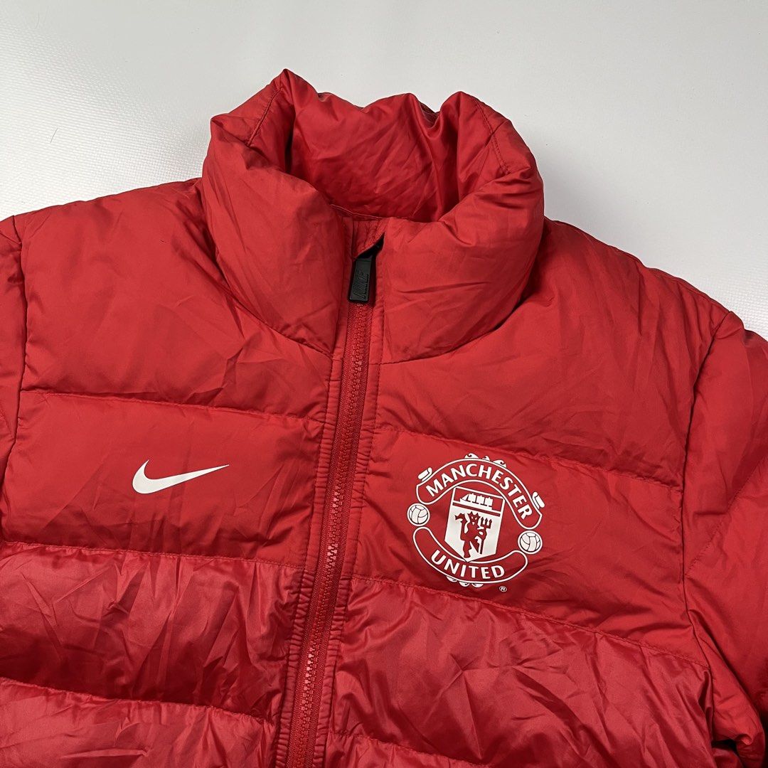 Nike Manchester Puffer Jacket (Category: Coats, Jackets and Outerwear) located in Lucena. Submitted by RAGGGGSSSS (Listing ID 1459406132, Image 2). Description: 2013-2014 Machester United Puffer Jacket Small on Tag 27x21 Excellent Condition Authentic No issue 1000 plus shipping fee.