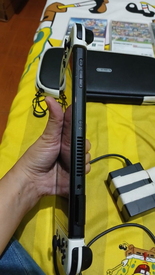 Nintendo Switch OLED Console with Games and Case (Category: Nintendo) located in Imus. Submitted by dahdahlicious (Listing ID 1459325682, Image 2). Description: - Nintendo Switch OLED Model console - Original dock and Joy-Cons included - Comes with a protective carrying case - Games included: Sonic Frontiers, Mario + Rabbids Sparks of Hope - All games are in their original cases - Ready for both home console and portable play.