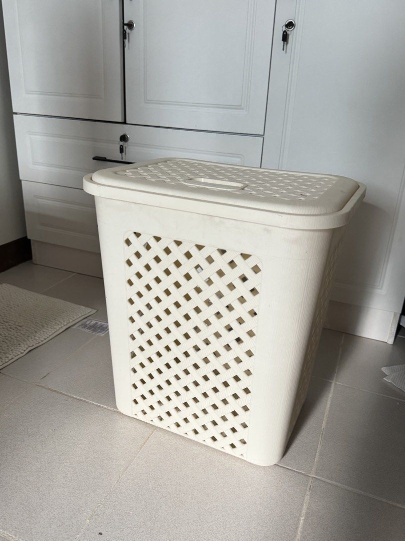 Off-white Laundry Basket with Lid (Category: Laundry Baskets) located in Pasay City. Submitted by margucci_0823 (Listing ID 1459330222, Image 1). Description: - Cream colored plastic laundry basket - With side handles - Woven pattern on sides for ventilation - Ideal size for small households RFS: no longer in use.