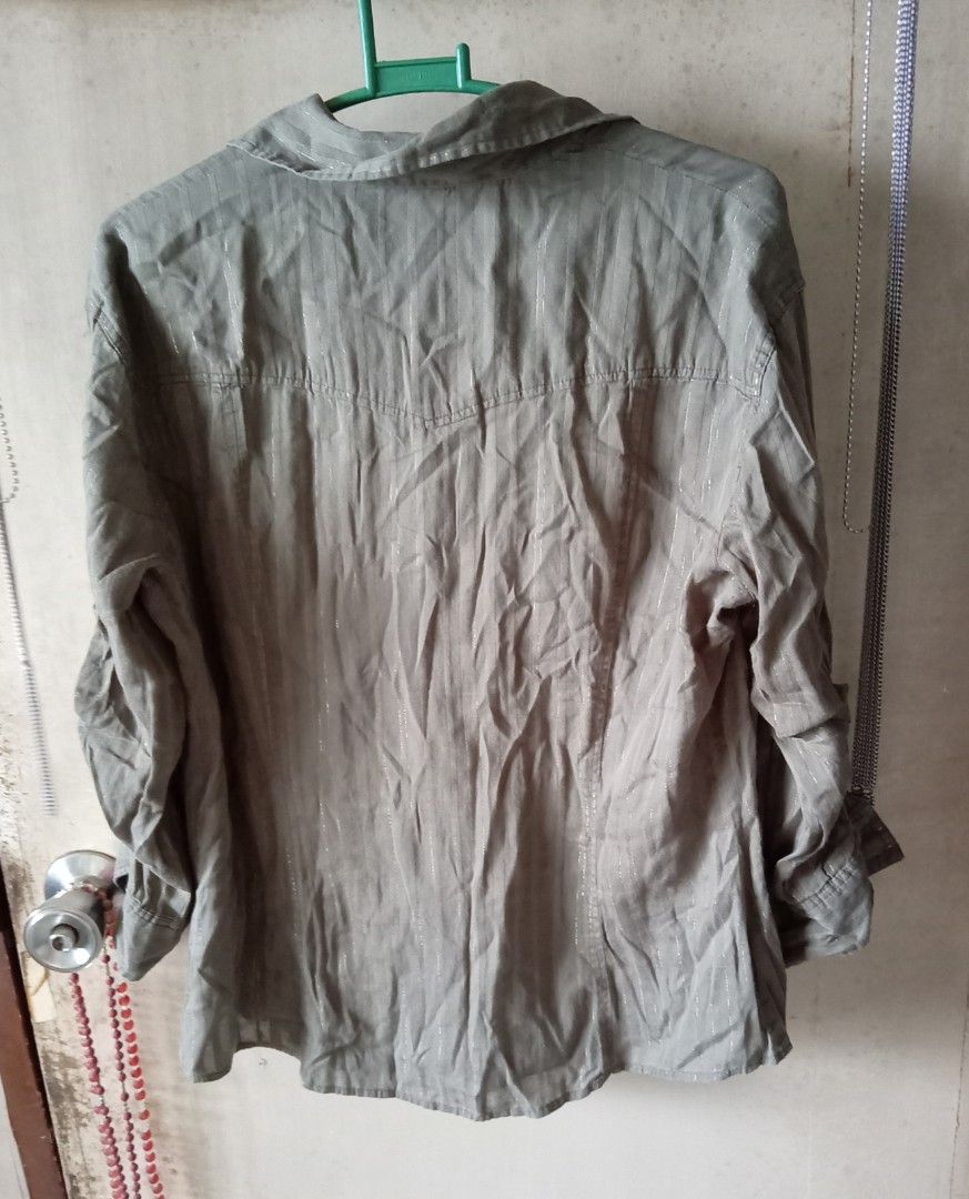 Olive Green Striped Button-Up Shirt (Category: Longsleeves) located in Quezon City. Submitted by chacha30.s (Listing ID 1459356346, Image 2). Description: - Olive green button-up shirt - Subtle vertical stripe pattern with a slight shimmer - Two chest pockets - Roll-up sleeve tabs - Relaxed fit - Ideal for casual wear . Text me at 09277152134 . Buy na po kayo/Offer lang po kayoo... . Bili na po/Bili na po kayo sa shop ko. . Personal use nyo po or