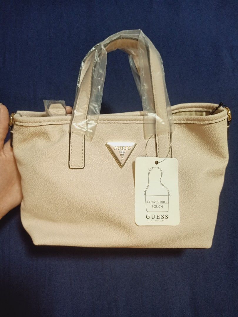 Original GUESS handbag (baby pink) (Category: Luxury Bags & Wallets) located in Manila. Submitted by tjgochum2342290 (Listing ID 1459361471, Image 2). Description: Original GUESS hand bag (baby pink) BRAND NEW GUESS BAG Model: Latona mini FULL SET: - Handbag - Strap - Pouch - Mini wallet - Dust cover PAYMENT METHOD: - Gcash DELIVERY: - Lalamove - Gogo Xpress (buyer will carry shipping fee) (message seller for inquiry/negotiations).