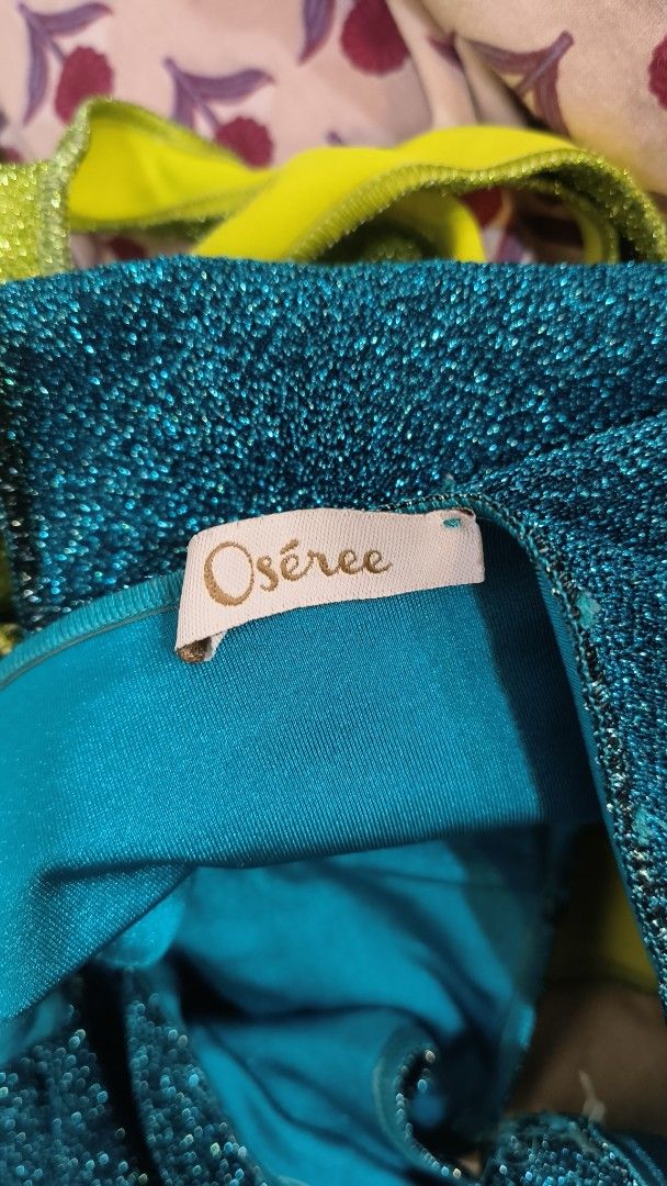 Oséree Glitter Bikini Set Teal & Lime Green (Category: Bikinis & Swimsuits) located in Makati City. Submitted by fashion_thrift_ (Listing ID 1459289501, Image 2). Description: Sparkly Oseree bikini set. Teal blue bikini top and lime green bikini bottoms. Both pieces have a glittery finish. The top has a scoop neck and tank straps. The bottoms are high-waisted. Great for the beach or pool..
