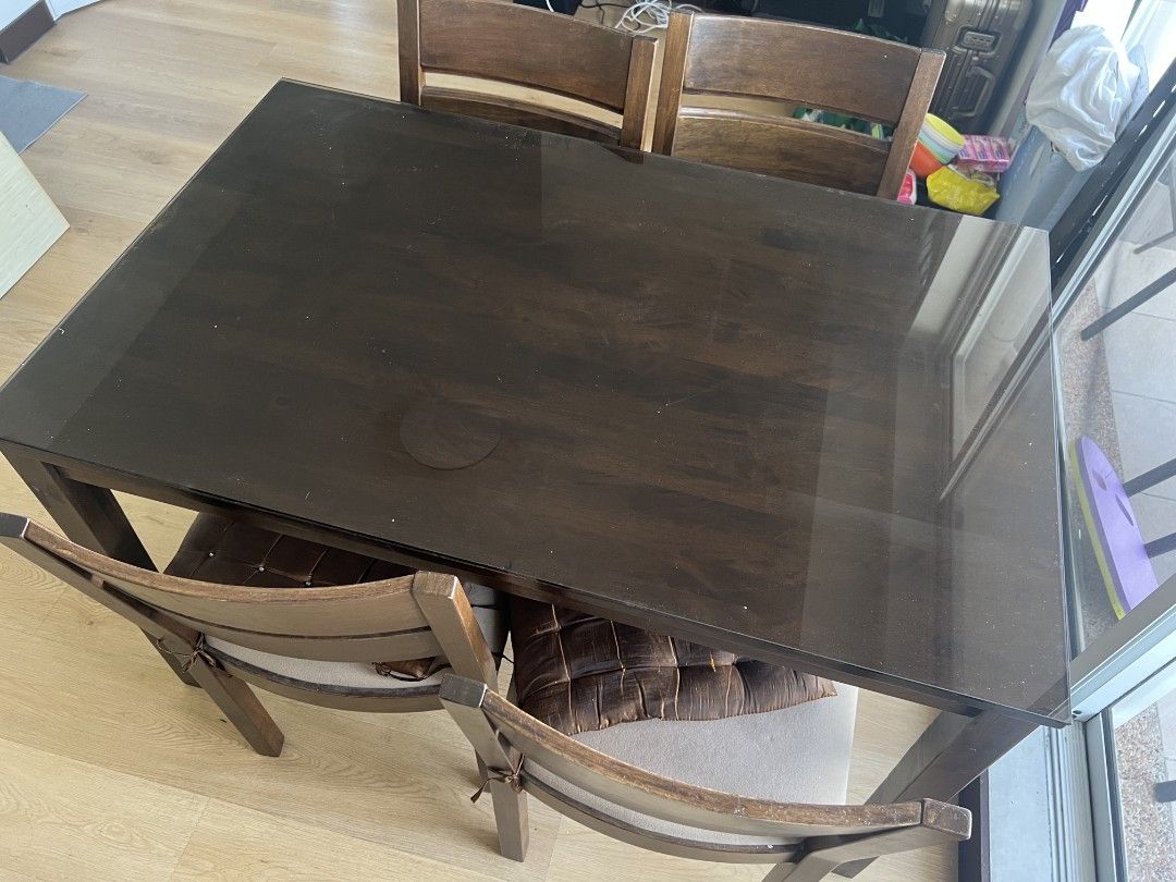 Our Home Dining set (Category: Tables & Sets) located in Manila. Submitted by vi_ka (Listing ID 1459458111, Image 3). Description: dark wood dining set. Includes customized glass top and four chairs. from our home made in malaysia.