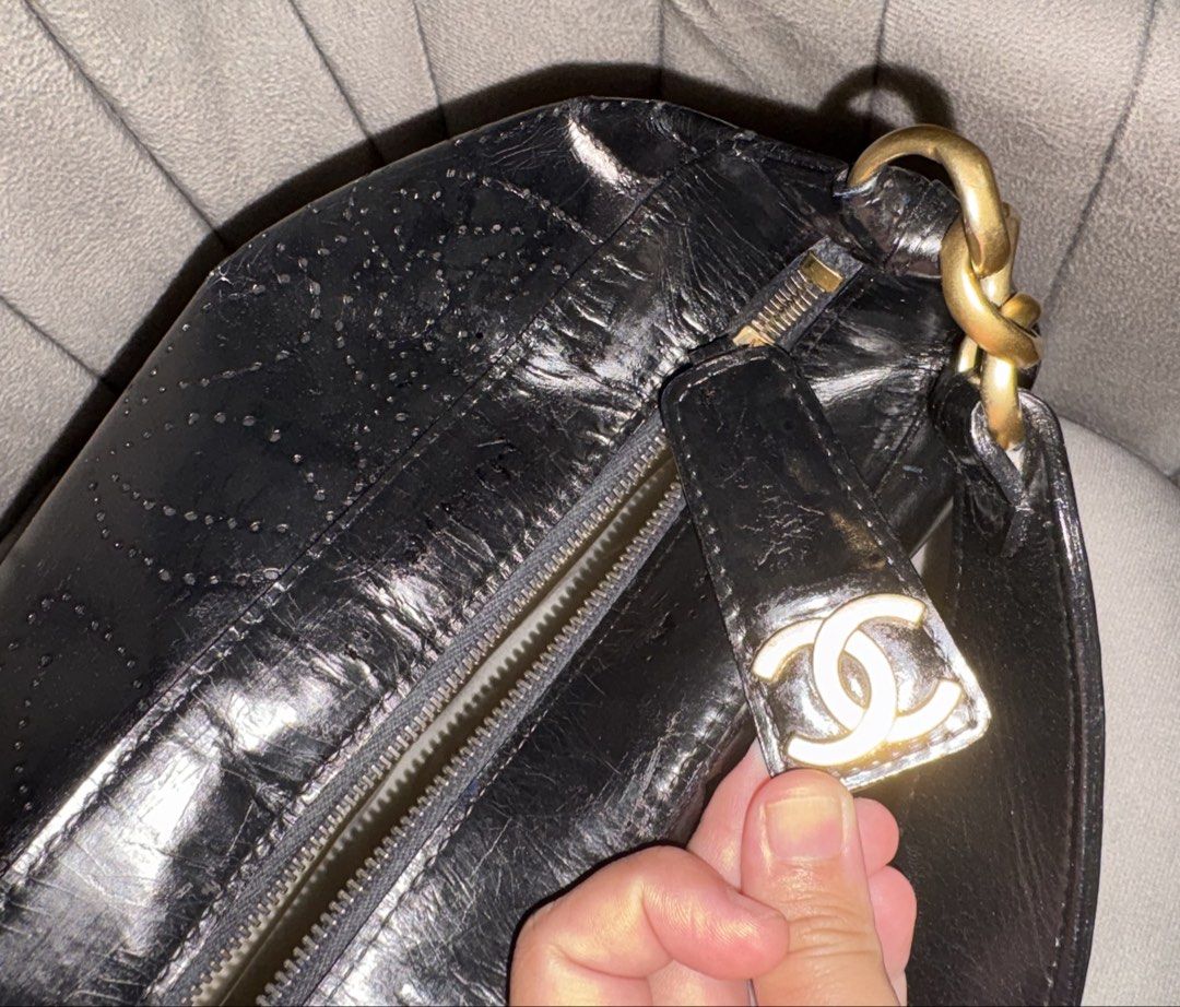 Perforated Camellia Shoulder bag (Category: Luxury Bags & Wallets) located in Bacoor. Submitted by grandfire.02c841 (Listing ID 1459303856, Image 3). Description: - Authentic Chanel Hobo Bag - Color: Black - Material: Patent Leather, retouched by Prime Restore (paid 10k for this!) - Design: Camellia Cut-out Details - Hardware: Gold - Closure: Zipper - Includes: Certificate of Authenticity (COA), authenticity card, no more hologram - Ideal for: Ev