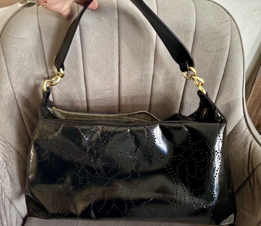 Perforated Camellia Shoulder bag (Category: Luxury Bags & Wallets) located in Bacoor. Submitted by grandfire.02c841 (Listing ID 1459303856, Image 2). Description: - Authentic Chanel Hobo Bag - Color: Black - Material: Patent Leather, retouched by Prime Restore (paid 10k for this!) - Design: Camellia Cut-out Details - Hardware: Gold - Closure: Zipper - Includes: Certificate of Authenticity (COA), authenticity card, no more hologram - Ideal for: Ev