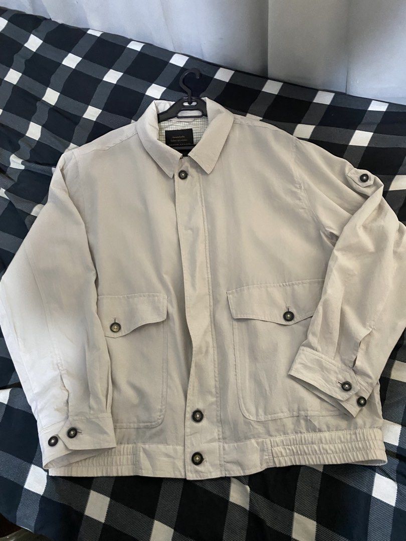 Peter Luccer Beige Utility Jacket (Category: Coats, Jackets and Outerwear) located in Caloocan City. Submitted by royalturtle-1071 (Listing ID 1459296966, Image 2). Description: - Beige utility jacket by Peter Luccer - Estimated size: Medium - Two chest pockets with button closure - Two lower flap pockets - Button front closure with zip underneath - Elasticated waistband for a comfortable fit - Button cuffs - Ideal for casual outfits.