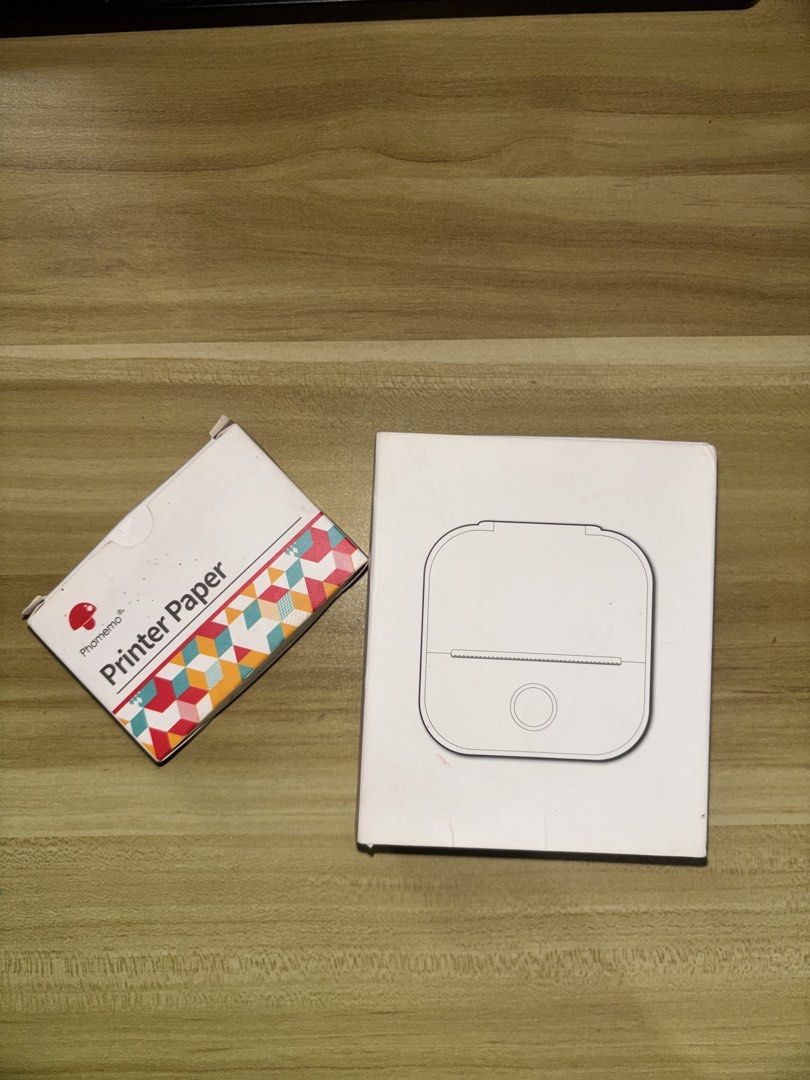 Phomemo Mini Printer T02 with Printer Paper | Compatible with IOS and Android (Category: Printers, Scanners & Copiers) located in Manila. Submitted by _mica3 (Listing ID 1459365229, Image 1). Description: Inclusions: > Includes 2 roll of thermal paper (One unused, one inside the printer) > Original box and manual included !! PRICE IS STILL NEGOTIABLE !! .