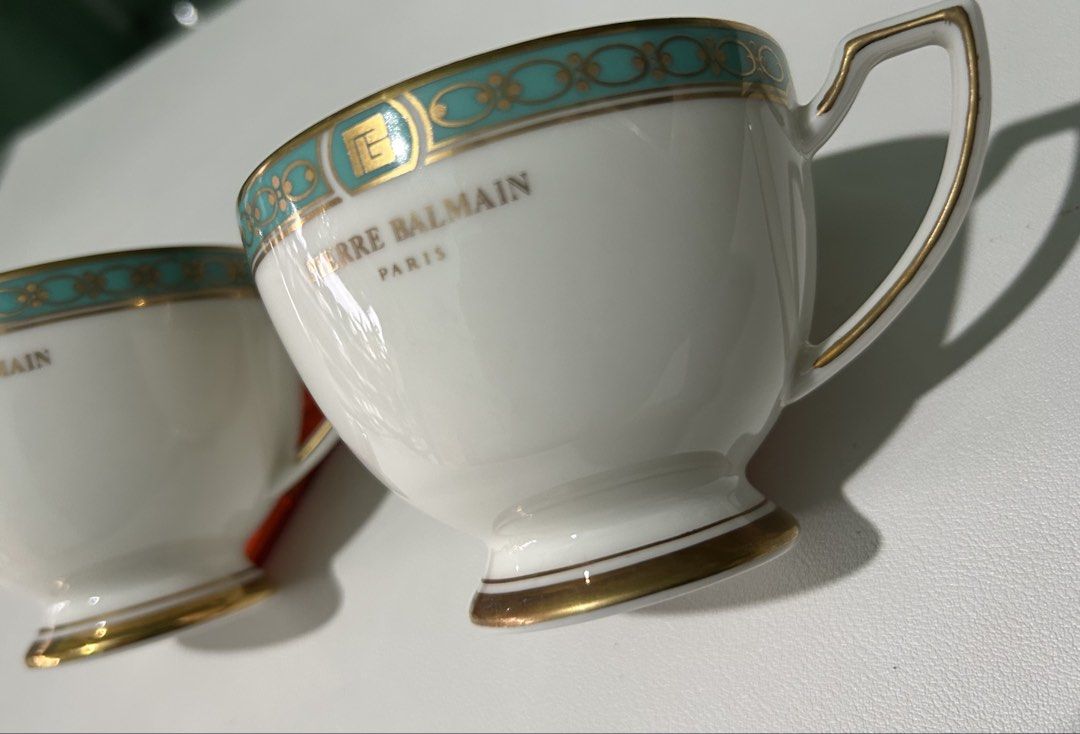 Pierre Balmain Paris Teacups S (Category: Coffee & Tea Tableware) located in Cagayan de Oro. Submitted by aljay02 (Listing ID 1459375525, Image 2). Description: - Set of 2 authentic Pierre Balmain teacups - Exquisitely crafted in Paris - Elegant turquoise and gold trim design - Base stamped 'Produced by YAMAKA' - Ideal for enjoying your favorite coffee or tea - Adds a luxurious touch to your kitchenware - 2 Teacups Only.